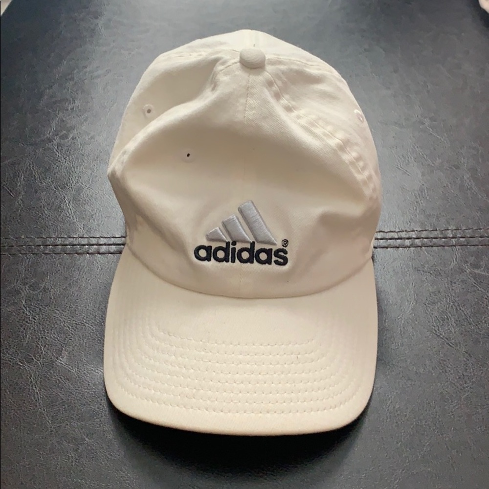 White Adidas hat with elastic hat.